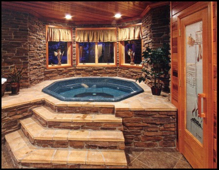 The lower-level hot tub nestles in a stone grotto.