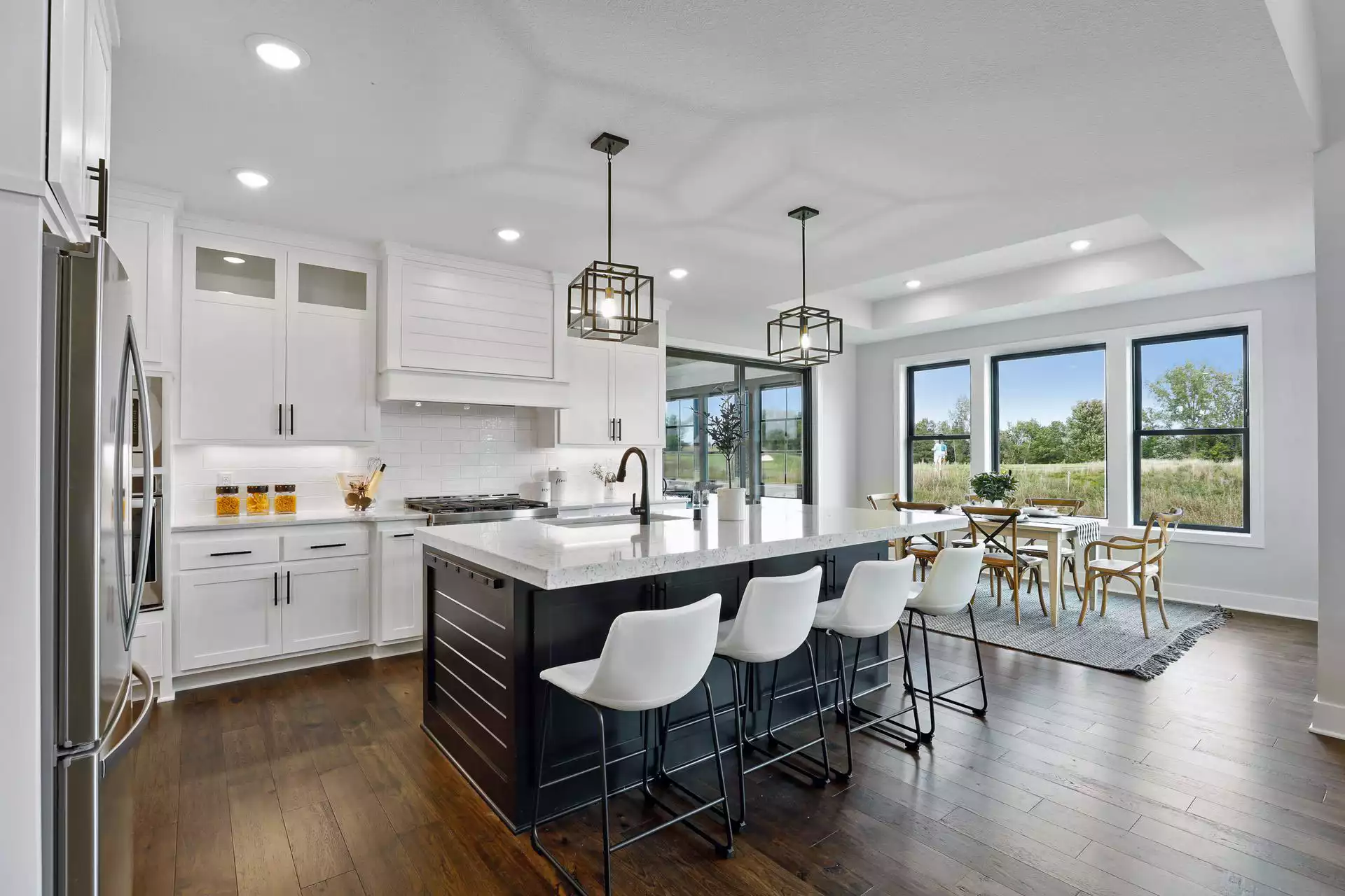 Beautiful white kitchen with wood floors