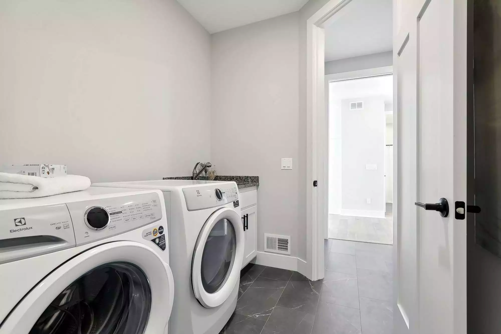 Laundry room with wide accessible entry doors