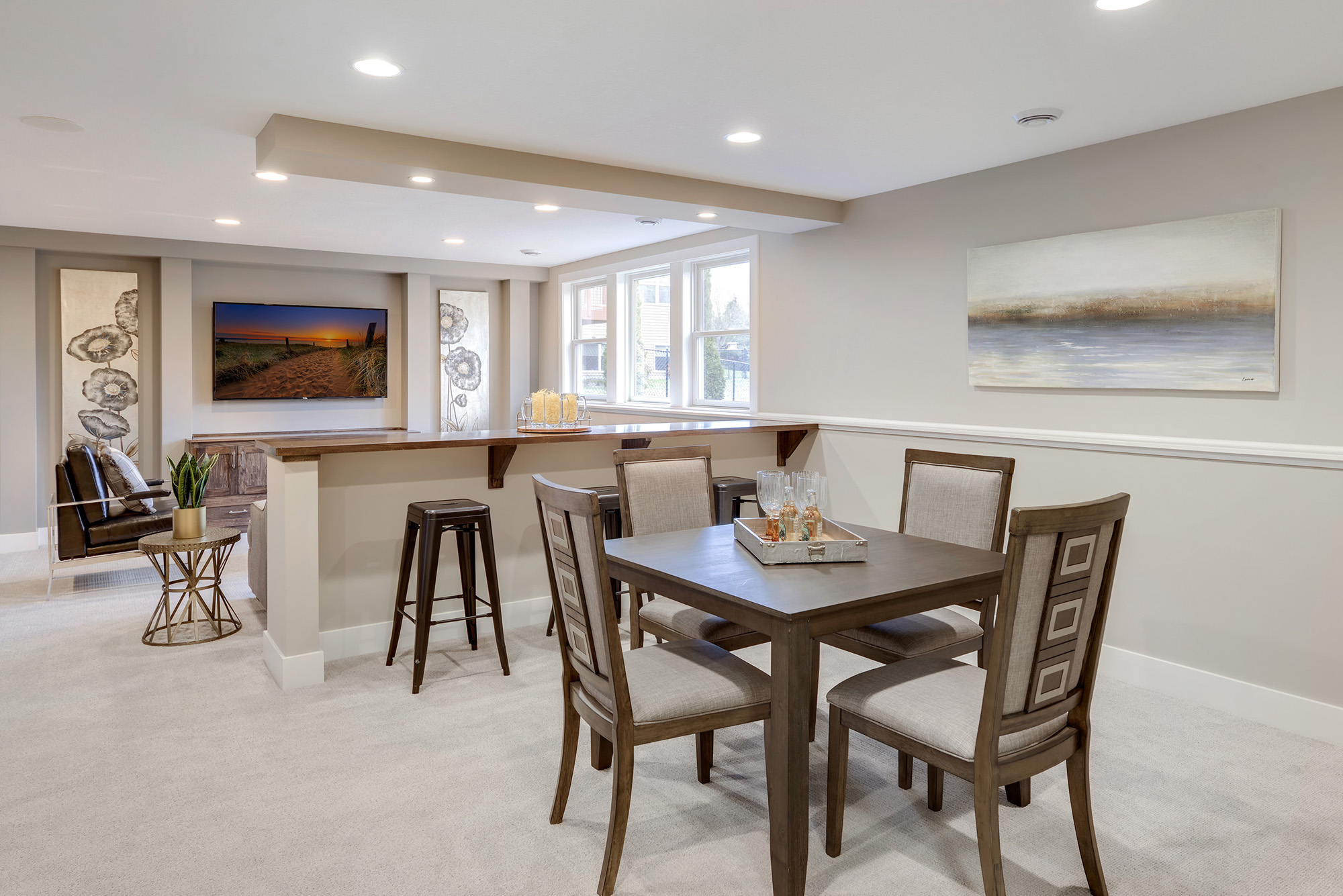 The finished basement game area, island and media room