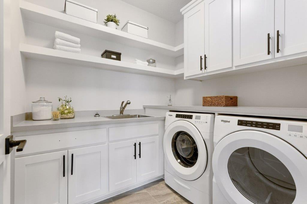 Spacious laundry and mudroom with a walk-in closet