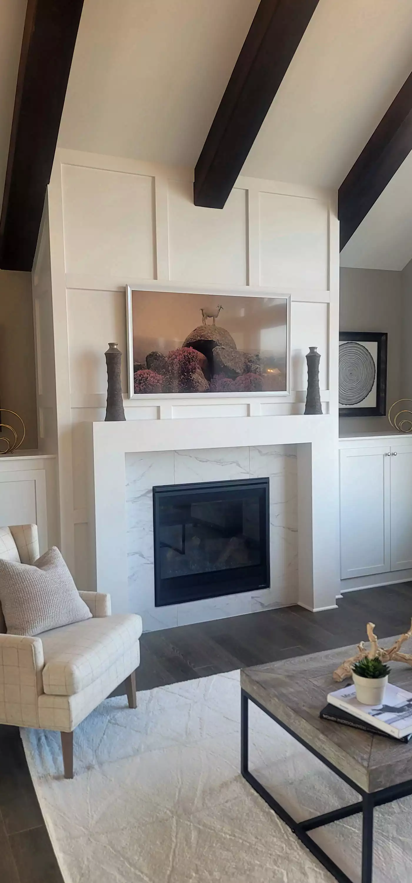 Custom designed fireplace all with flanking built-ins
