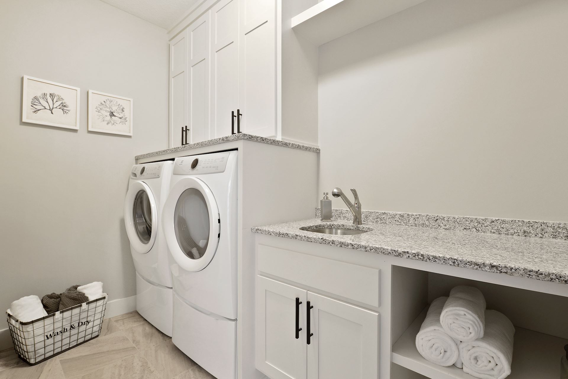 Laundry Room applicance on pedestals and granite counters