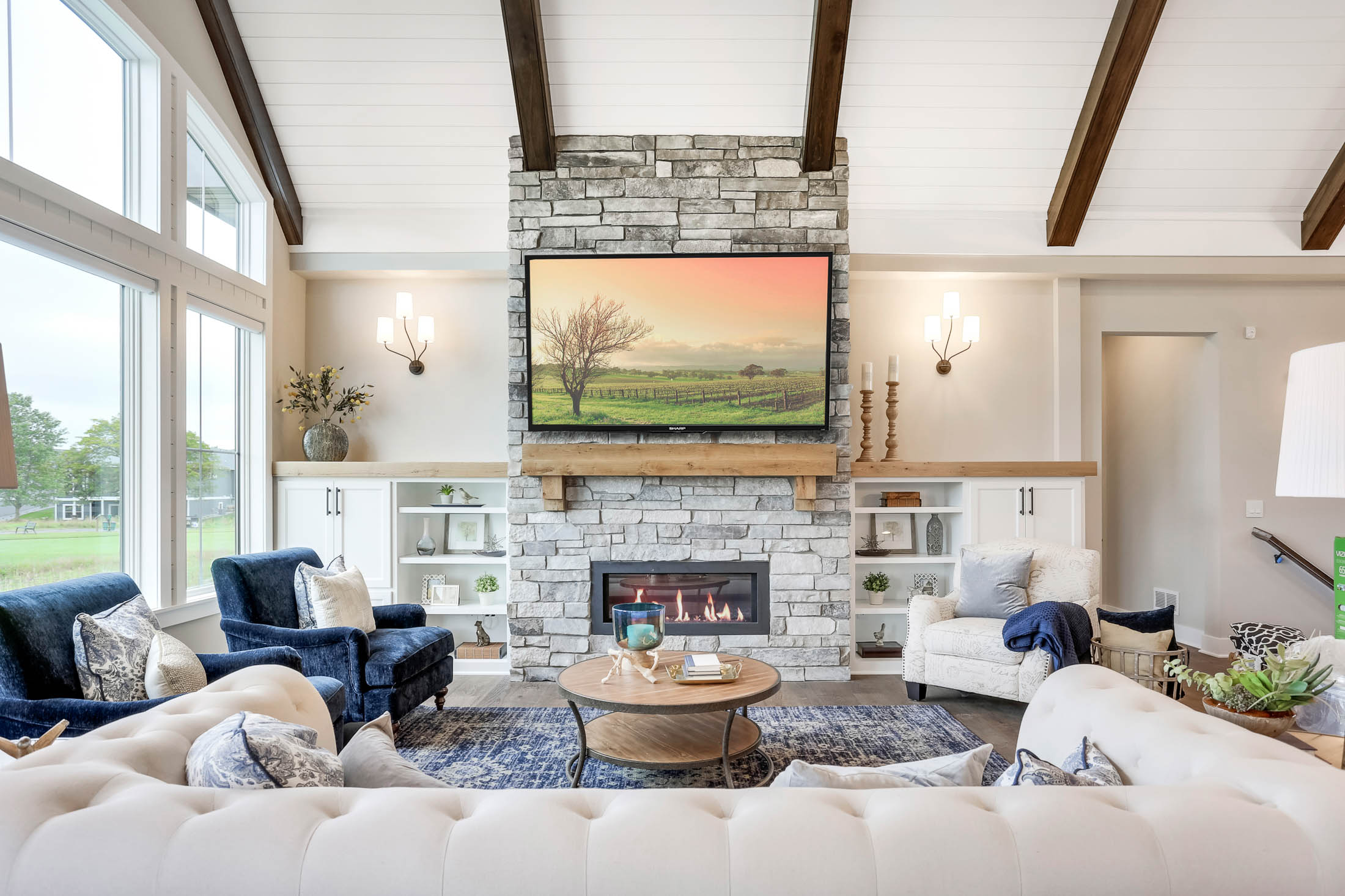 Stone fireplace with mantle TV